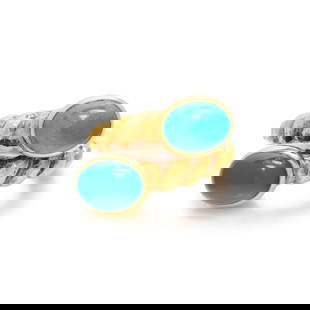 DAVID WEBB, YELLOW GOLD AND TURQUOISE RING: DAVID WEBB, YELLOW GOLD AND TURQUOISE RING In a by-pass design with cabochon turquoise and hammered gold rope shank. Ring size 3 3/4. Stamps: WEBB 18K. Gross weight: 9.70 dwt. Dancing Light: