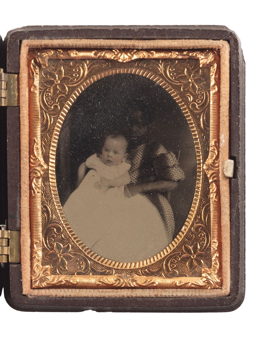 [EARLY PHOTOGRAPHY]. Ninth plate tintype portrait featuring a young African American girl holding a (1 of 2)
