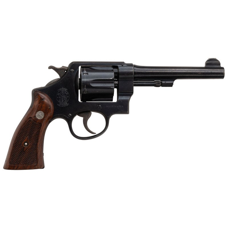 **Smith & Wesson DA .45 Hand Ejector Model of 1917 (Postwar-Transitional): **Smith & Wesson DA .45 Hand Ejector Model of 1917 (Postwar-Transitional) .45 ACP. 5.5" barrel length. SN: 209929. Blued metal finish with casehardened hammer and trigger mounting checkered walnut