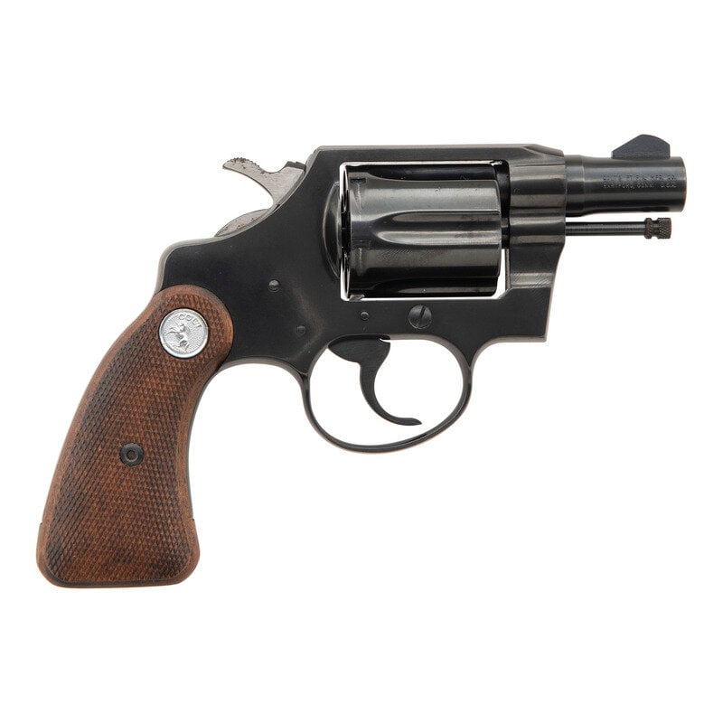 **Colt Detective Special in Original Box: **Colt Detective Special in Original Box Manufactured 1968 .38 Special. 2" barrel length. SN: 965824. Blued metal finish. Grips are checkered walnut with silver Colt medallions. Double action revolver