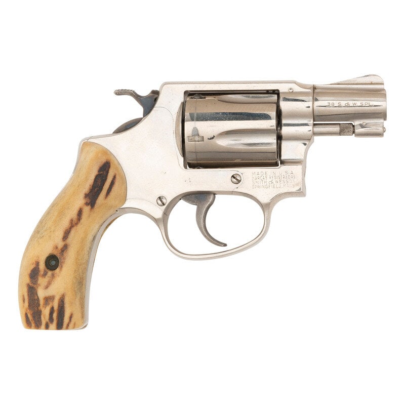 **Smith & Wesson .38 Chief's Special Pre-Model 36: **Smith & Wesson .38 Chief's Special Pre-Model 36 .38 Special. 1.875" barrel length. SN: 124891. Nickel plated finish with casehardened hammer and trigger mounting bone grips. Double action five-s