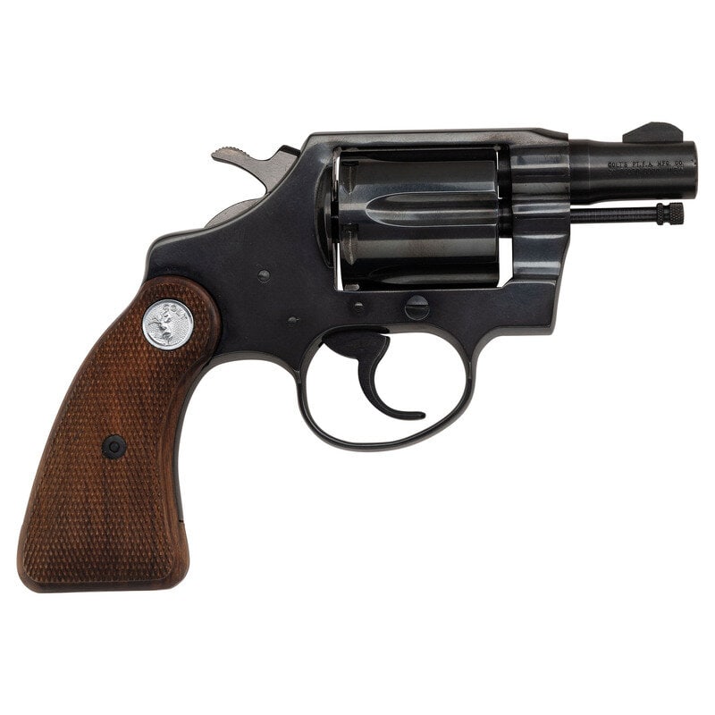 **2nd Issue Colt Detective Special: **2nd Issue Colt Detective Special Manufactured 1970 .32 New Police. 2" barrel length. SN: B01724. Blued metal finish with stainless steel hammer. Walnut grips have checkering and silver Colt medallio