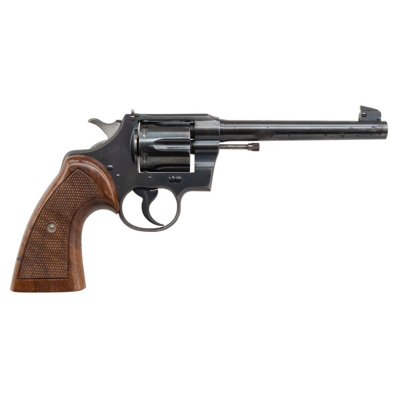 **Colt Officers Model: **Colt Officers Model .38 Special. 6" barrel length. SN: 596583. Blued metal finish with polished hammer flanks mounting aftermarket checkered walnut thumb rest grips. Double action hand ejector six-s
