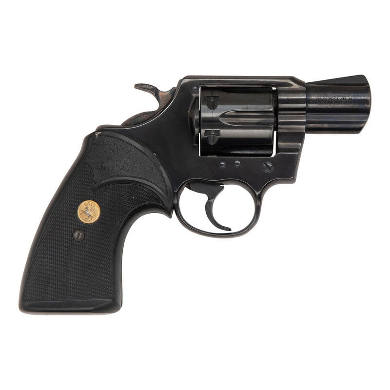 *Colt Lawman MK III: *Colt Lawman MK III .357 Magnum. 2" barrel length. SN: 18822U. Blued metal finish. Grips are checkered rubber with gold Colt medallions. Double action revolver with frame notch rear sight and ramp b
