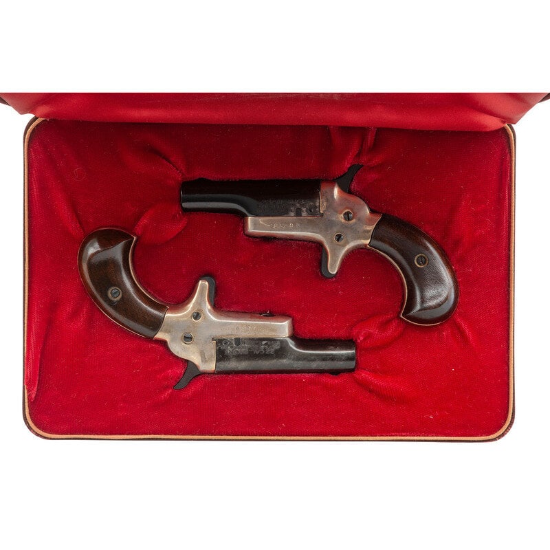 * Colt Lord and Lady Set: *Colt Lord and Lady Set 1.) .22 Short. 2.5" barrel length. SN: 20560D. Blued metal finish with silver plated frame mounting varnished walnut birdshead grips. Single shot rotating barrel pistol in two-