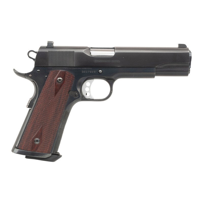 *Colt Delta Elite 10mm Custom: *Colt Delta Elite 10mm Custom 10mm Auto. 5" barrel length. SN: DE17929. Blued metal refinish overall with diamond checkered Cocobolo grips and mounting triple dot Trijicon tritium night sights. Short 