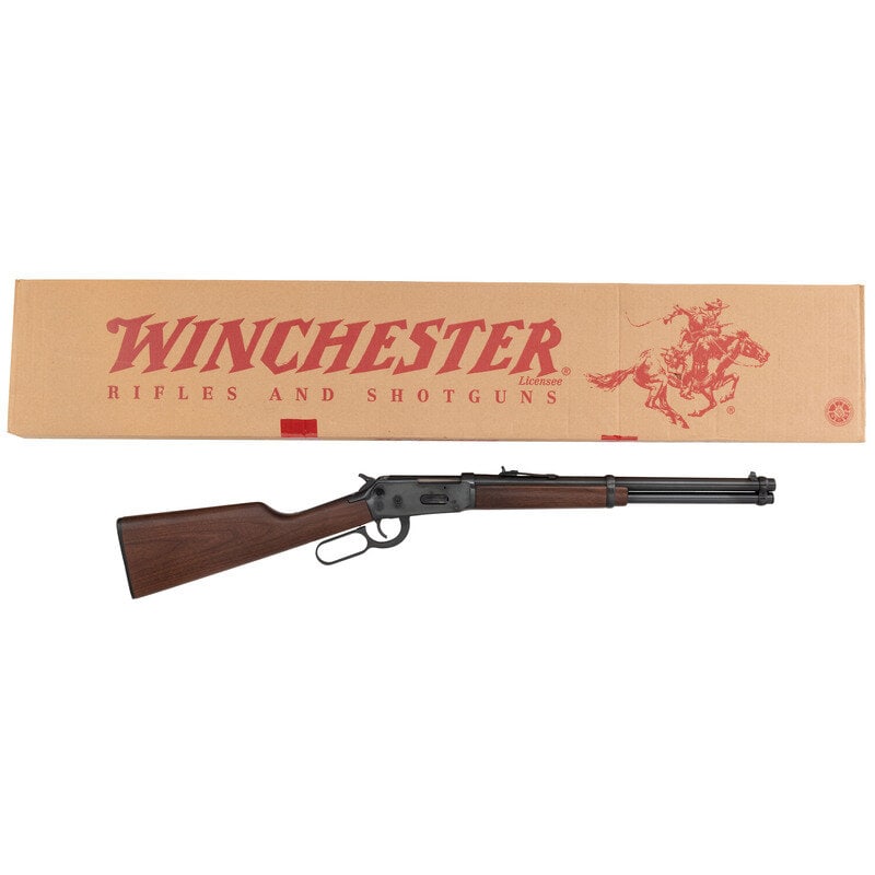 *Winchester Model 94AE in .44 Magnum with Original Box: *Winchester Model 94AE in .44 Magnum with Original Box .44 Magnum. 20" barrel length. SN: 6414865. Blued metal finish. Two piece walnut stock has a plain straight grip and forearm. Lever action rifle 