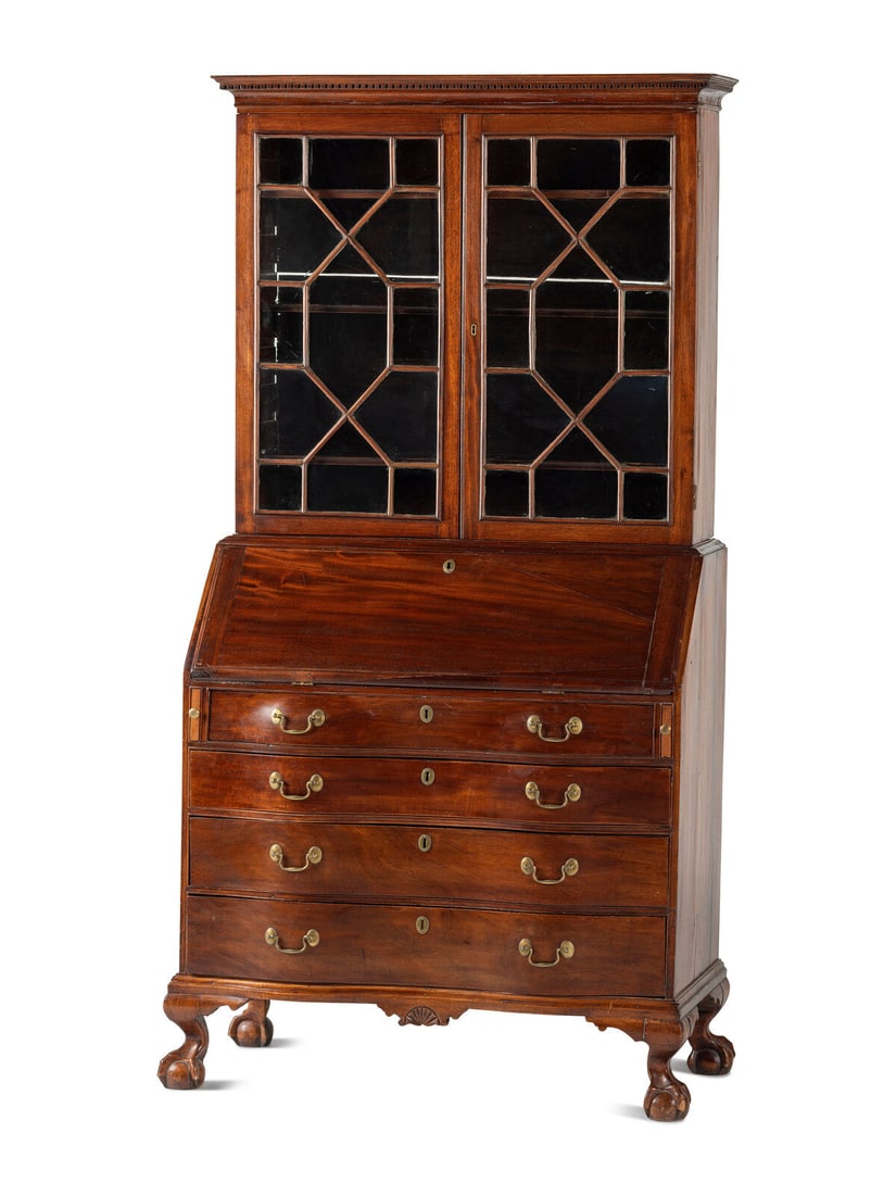 A Chippendale Mahogany and Cherrywood Serpentine Claw-and-Ball Foot Desk-and-Bookcase: A Chippendale Mahogany and Cherrywood Serpentine Claw-and-Ball Foot Desk-and-Bookcase Likely New England, Circa 1770 Height 83 1/2 x width 42 x depth 22 inches. Property from the Collection of a Priva