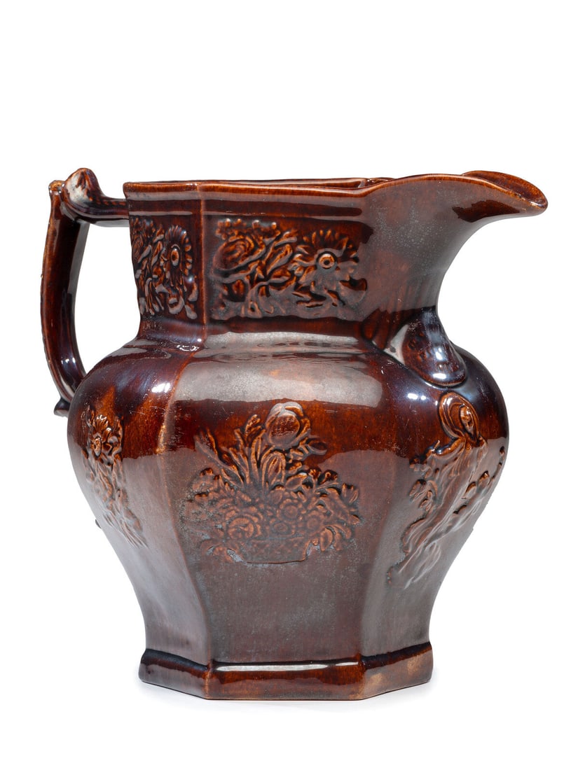 A Rare William Bromley Yellowware Panel Pitcher: A Rare William Bromley Yellowware Panel Pitcher Cincinnati, Ohio, late 1840s-1860s stamped indistinctly on underside. Height 9 1/4 inches.