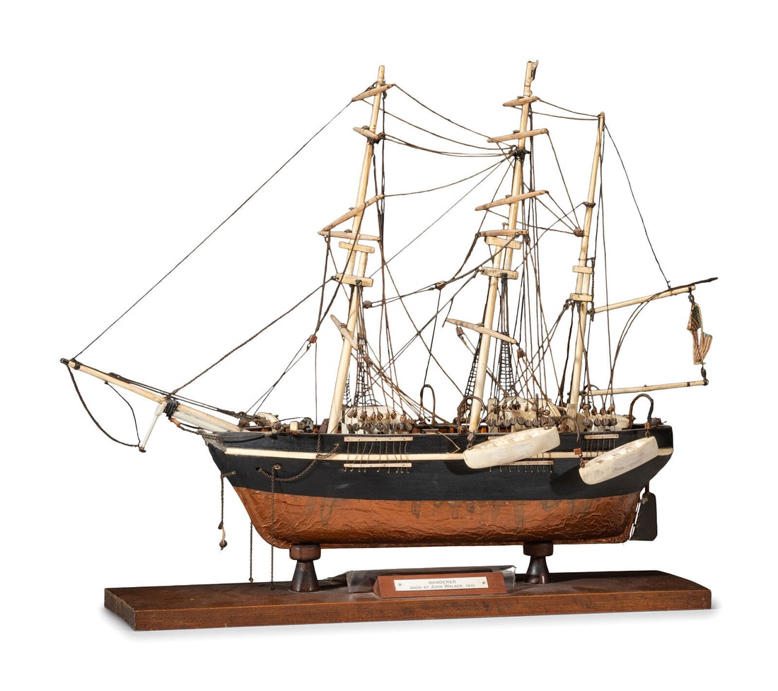 A Carved and Painted Wood Ship Model of the Wanderer: A Carved and Painted Wood Ship Model of the Wanderer Circa 1910 mounted on a wood base with plaque identifying maker as John Walker. Height 22 1/2 x width 29 inches. The Wanderer was an infamous schoo