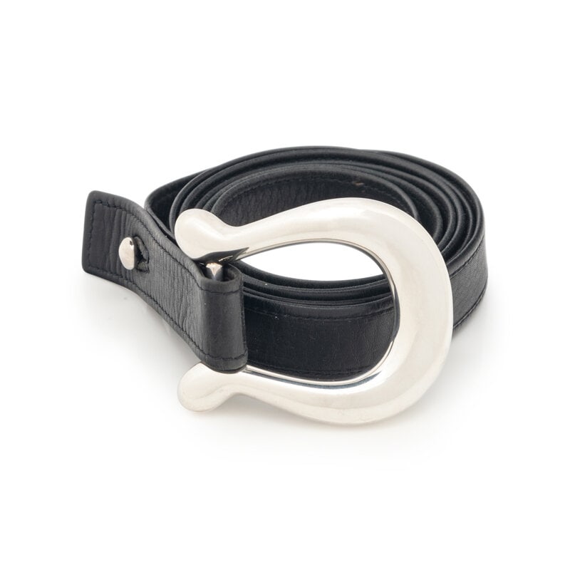 Elsa Peretti Belt for Tiffany & Co.,1975 : Elsa Peretti Belt for Tiffany & Co.,1975 Black leather wrap belt with sterling silver horseshoe-shaped buckle by Elsa Peretti for Tiffany & Co. Label: Tiffany & Co. Date: 1975<