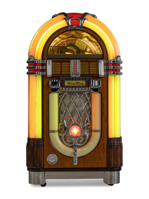 A Wurlitzer Model 1015-CD Juke Box: A Wurlitzer Model 1015-CD Juke Box includes key. Height 60 x width 33 inches. This lot is located in Chicago. Property from the Collection of Catharine and David Hamilton, Chica