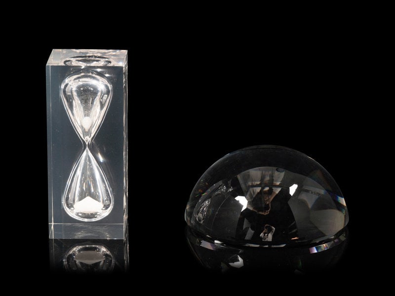 A Ralph Lauren Acrylic Clark Hourglass and a Glass Clayton Dome Paperweight: A Ralph Lauren Acrylic Clark Hourglass and a Glass Clayton Dome Paperweight the dome marked Ralph Lauren, the hourglass marked RL. Height of hourglass 7 1/2