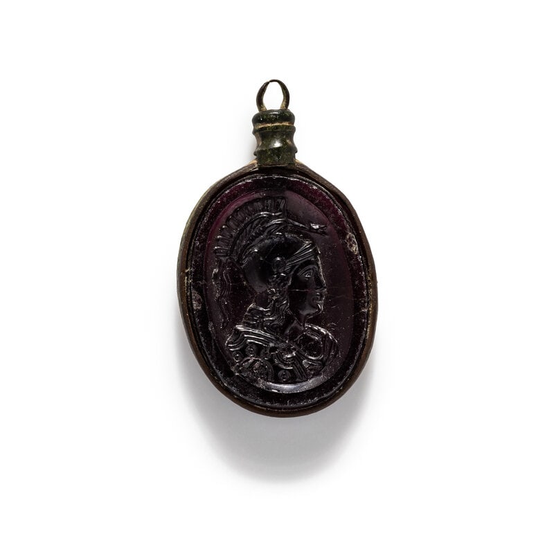 A Neoclassical Glass Cameo Pendant of Minerva: A Neoclassical Glass Cameo Pendant of Minerva Circa 19th Century A.D. This lot is located in Chicago.