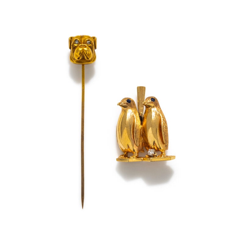 COLLECTION OF YELLOW GOLD ANIMAL JEWELRY: COLLECTION OF YELLOW GOLD ANIMAL JEWELRY Penguin motif pendant/brooch with one round brilliant cut diamond and sapphire eyes, together with a bulldog stickpin with rose cut diamond eyes. Yellow gold. 
