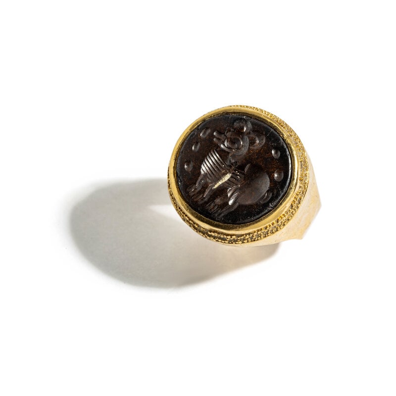 ED WIENER, YELLOW GOLD AND JASPER RING: ED WIENER, YELLOW GOLD AND JASPER RING Carved jasper depicting a hoofed animal measuring approximately 17.00 x 17.85 mm. 18 karat yellow gold. Ring Size: 9 1/2. Stamp: 18K (Ed Weiner hallmark) Gross w