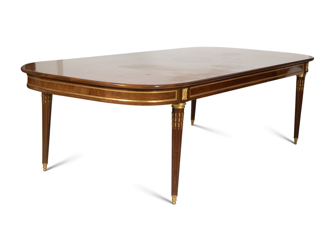 A Louis XVI Style Gilt Bronze Mounted Mahogany Dining Table (1 of 4)