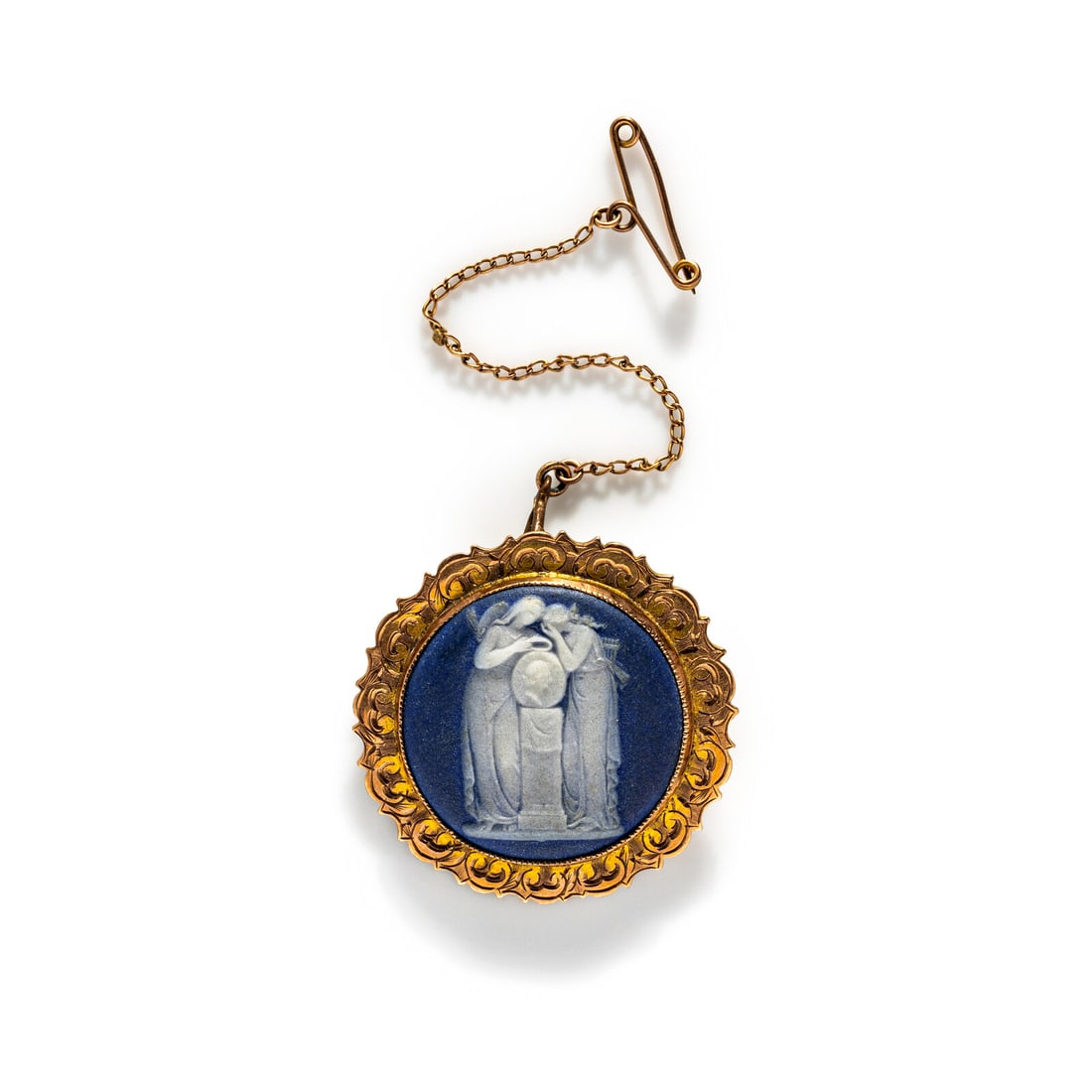 A Neoclassical Gold and Cameo Brooch with a Mourning Goddess: A Neoclassical Gold and Cameo Brooch with a Mourning Goddess Width 1 3/8 inches (3.49 cm); 10 karat gold; 5.32 dwt.