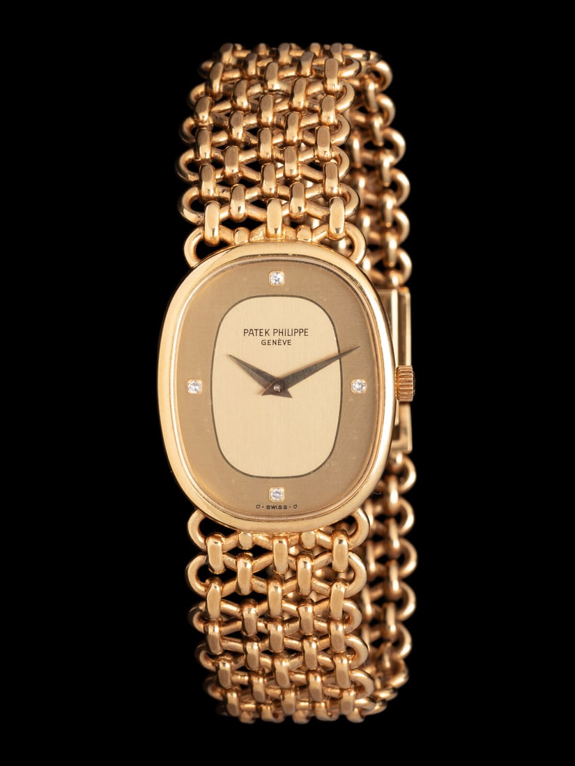 PATEK PHILIPPE, 18K YELLOW GOLD 'ELLIPSE' WATCH (1 of 3)