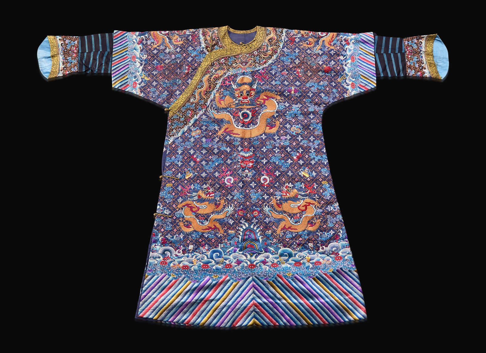 A Chinese embroidered blue silk "Nine-Dragon robe, Qing dynasty, circa 1900 海水江 (1 of 3)