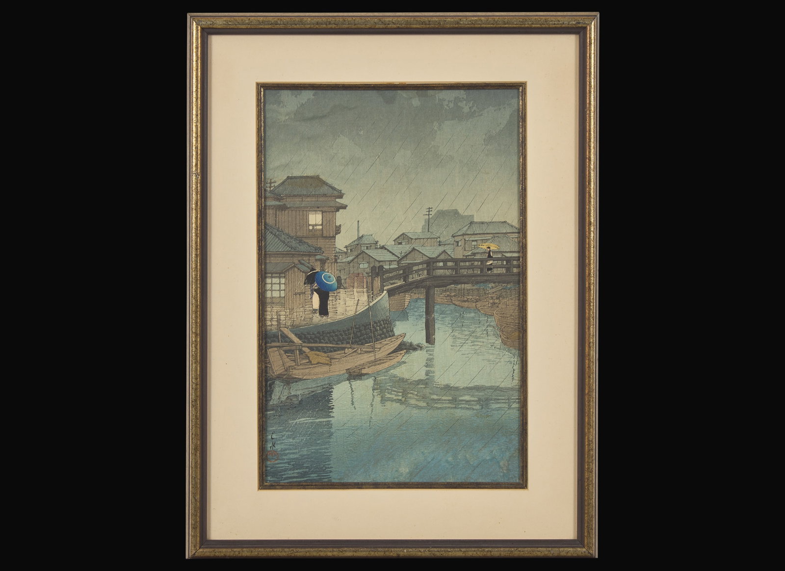 Hasui Kawase (Japanese, 1883 – 1957) 川瀬巴水(日本: Hasui Kawase (Japanese, 1883 – 1957) 川瀬巴水(日本 1883-1957) Rain in Shinagawa Woodblock printed in colors, framed. matted and glazed H: 13 7/8 in; W: 9 in. 