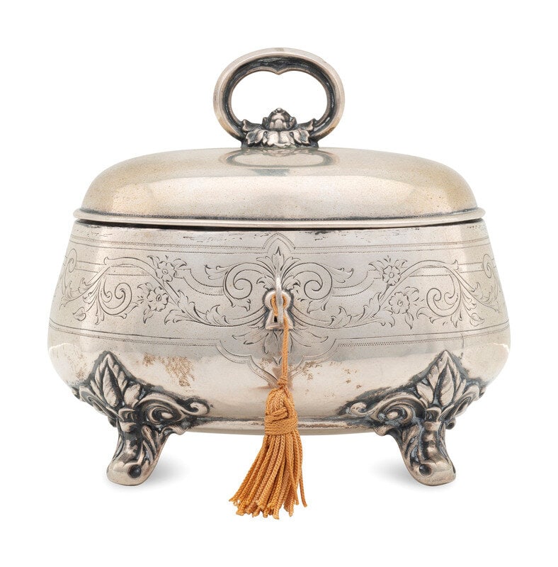A Silver Tea Caddy: A Silver Tea Caddy Likely German, 19th Century stamped 750 on underside. 8 ozt 17 dwt Height over handle 5 x width 5 x depth 4 inches. This lot is located in Cincinnati.</
