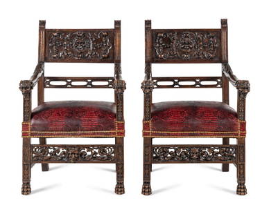 A Pair of Italian Renaissance Revival Carved Walnut Armchairs: A Pair of Italian Renaissance Revival Carved Walnut Armchairs Style of Luigi Frullini, Mid-19th Century Height 46 x width 28 x depth 27 inches. This lot is located in Chicago.