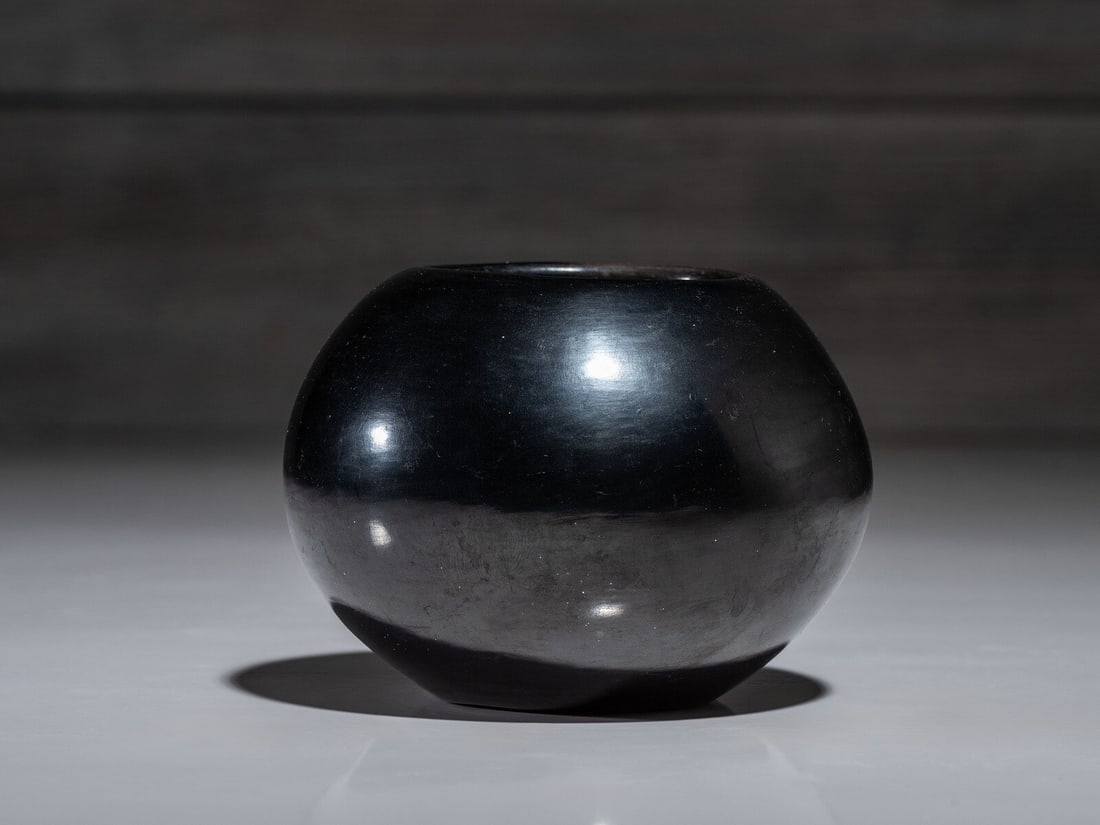 Maria Martinez and Popovi Da (San Ildefonso, 1887-1980 / 1923-1971) Blackware Bowl, with Gunmetal: Maria Martinez and Popovi Da (San Ildefonso, 1887-1980 / 1923-1971) Blackware Bowl, with Gunmetal FinishSeptember 1970 signed and dated on base height 3-1/4 inches x diameter 4-1/4 inches This lot is