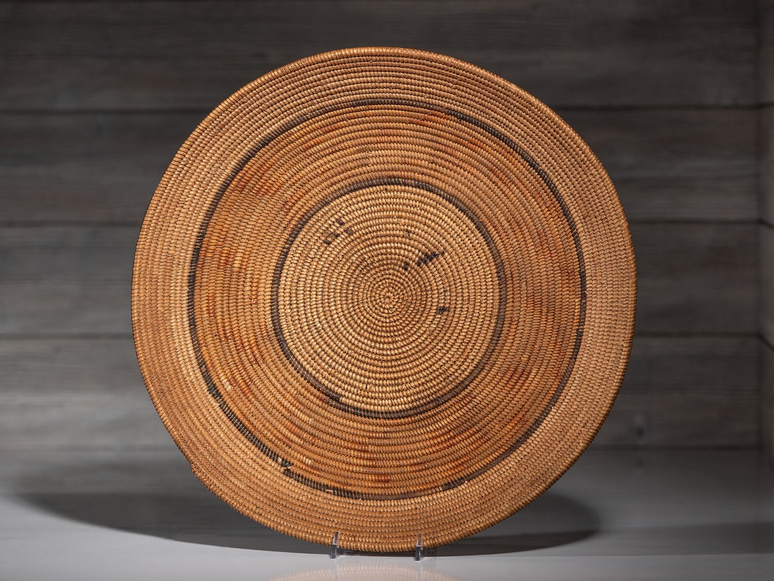 Southern California Winnowing Tray: Southern California Winnowing Tray early 20th century designed with concentric circles height 2-1/4 inches x diameter 15-3/4 inches This lot is located in Cincinnati.