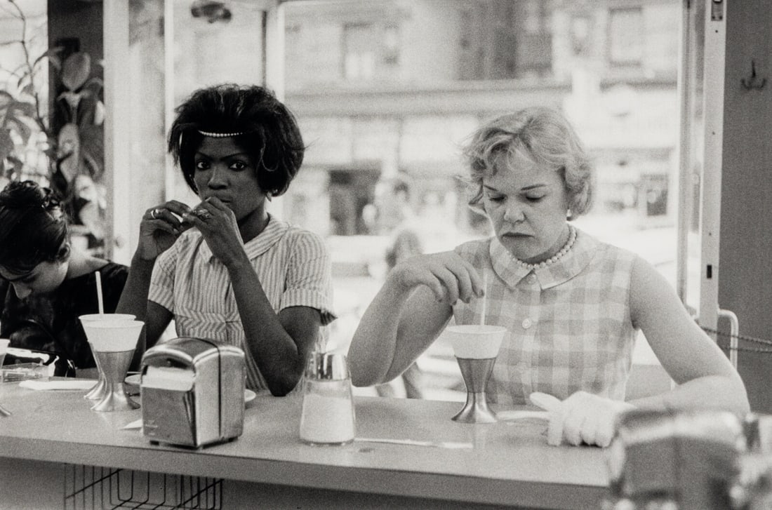 Bruce Davidson (American, b. 1933) Two Women At Lunch Counter (from Time of Change), 1962: Bruce Davidson (American, b. 1933) Two Women At Lunch Counter (from Time of Change), 1962 gelatin silver print printed later; signed in pencil, verso 8 3/4 x 13 inches.
