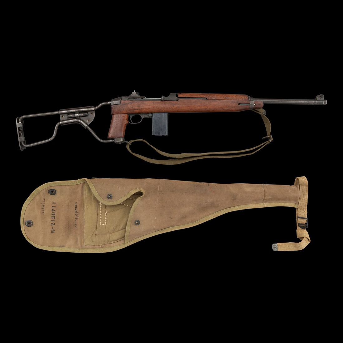 **Inland U.S. M1A Type I Paratrooper Carbine with Sling and Drop Bag: **Inland U.S. M1A Type I Paratrooper Carbine with Sling and Drop Bag World War II .30 Carbine. 18" barrel length. SN: 781888. Parkerized metal finish with high wood walnut pistol grip stock and mounti