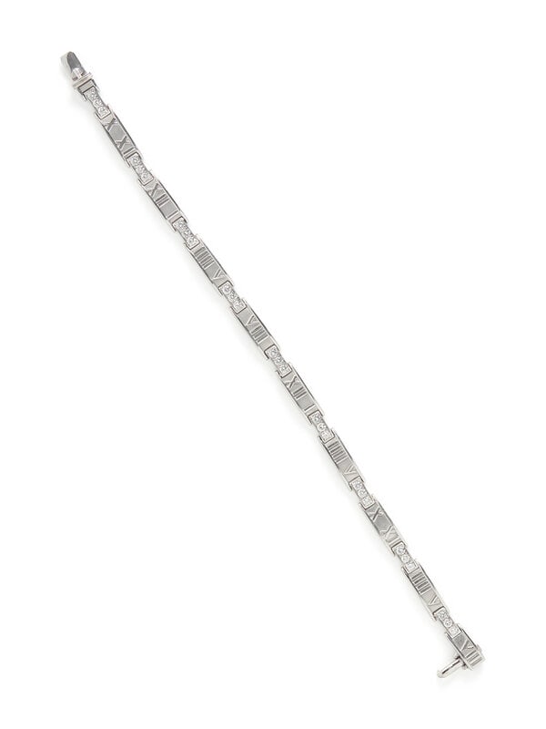 TIFFANY & CO., WHITE GOLD AND DIAMOND 'ATLAS' BRACELET: TIFFANY & CO., WHITE GOLD AND DIAMOND 'ATLAS' BRACELET Round brilliant cut diamonds weighing approximately 1.30 carats total. 18 karat white gold. 7 3/16 inches long. Stamp: 750 ITALY TIFFANY &
