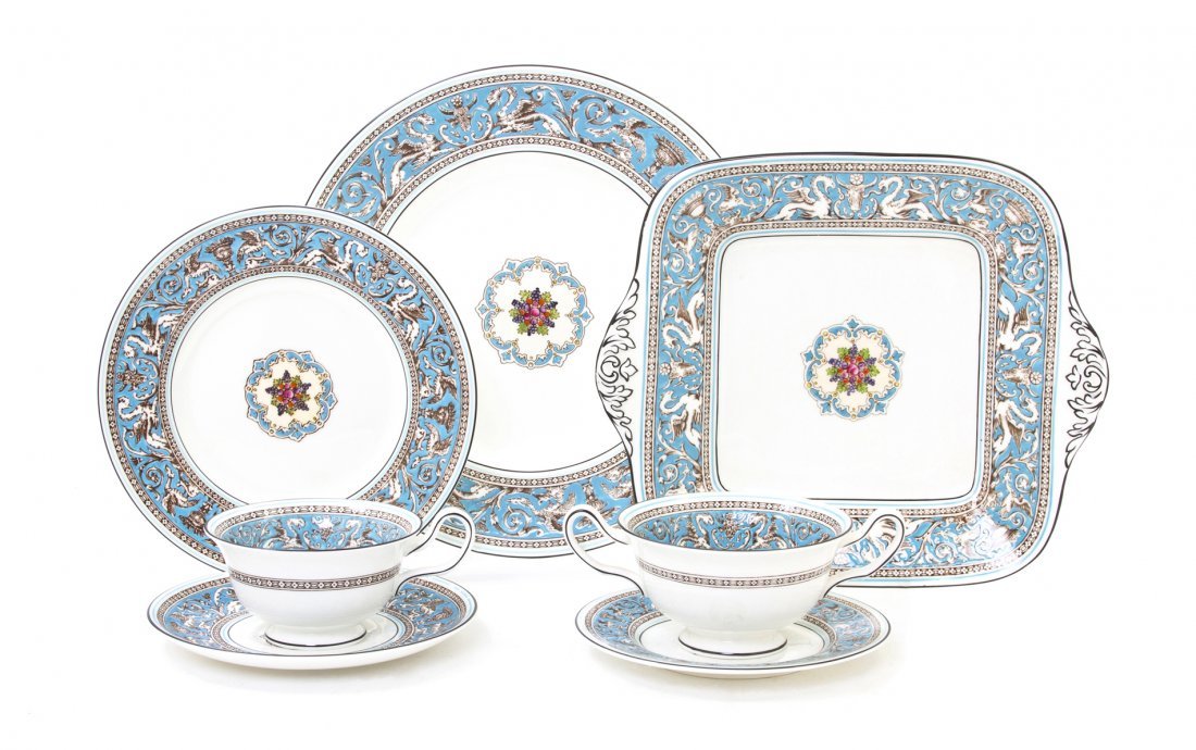 A Wedgwood Porcelain Dinner Service for Twelve, Di: A Wedgwood Porcelain Dinner Service for Twelve, in the Florentine Turquoise pattern, comprising dinner plates, luncheon plates, bread plates, coffee cups and saucers, soup bowls and saucers and a serv