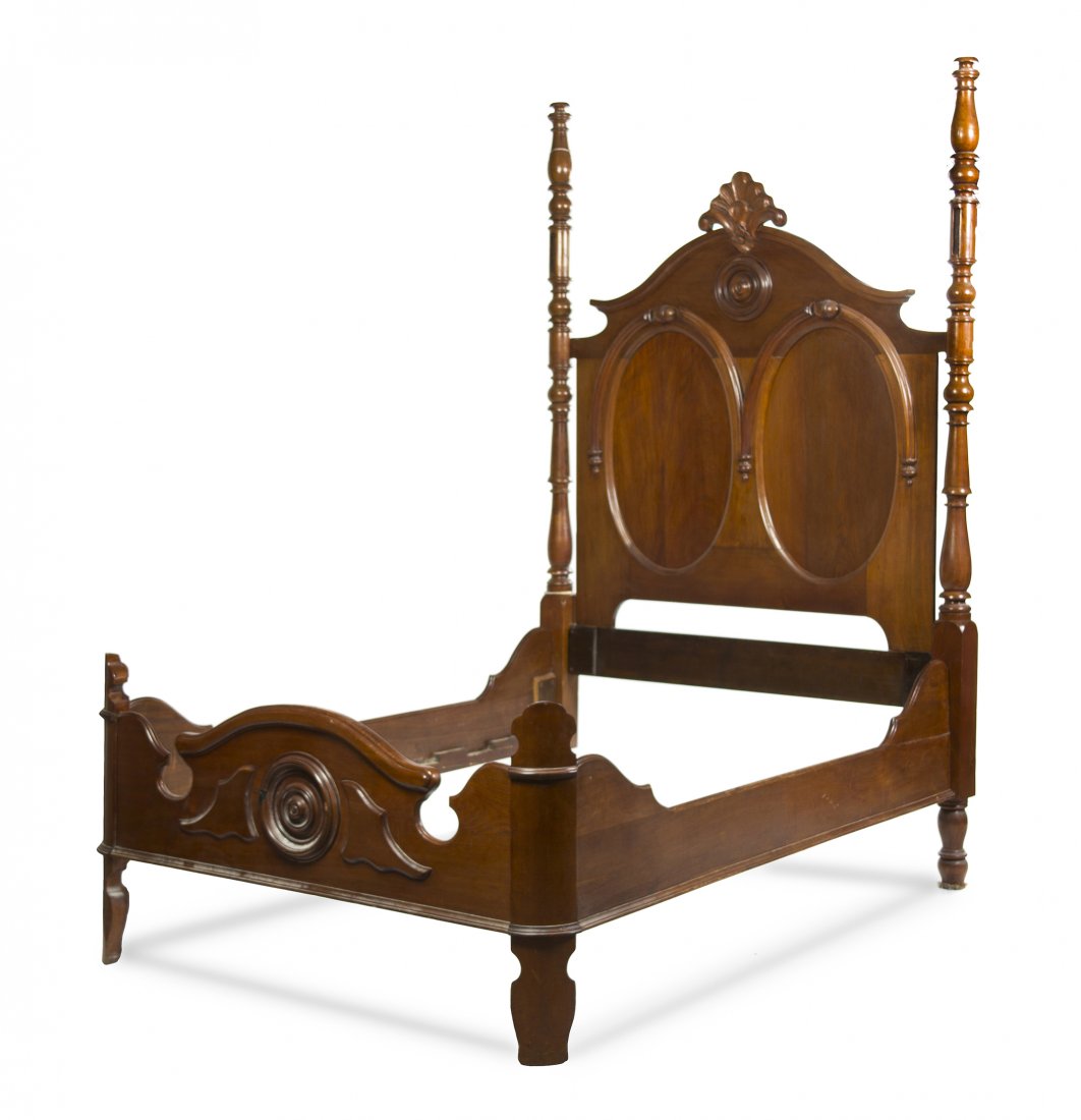 A Victorian Walnut Bed, Height 91 1/2 x width 60 i: A Victorian Walnut Bed, having a foliate carved crest over the paneled headboard, flanked by turned columns. Height 91 1/2 x width 60 inches. Property from the Estate of Mr. Chester E. Zarr, Western S