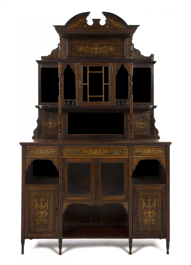 An Edwardian Marquetry Decorated Rosewood Sideboar: An Edwardian Marquetry Decorated Rosewood Sideboard, Birmingham Furnishing, in two parts, the superstructure centered with a beveled glass inset door, flanked by mirrored shelves, the base centered wi