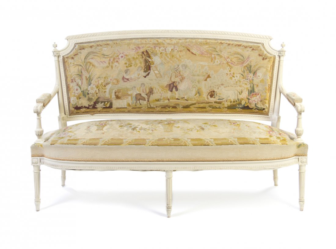 A Louis XVI Style Painted Parlor Suite, Height of : A Louis XVI Style Painted Parlor Suite, comprising a settee and four fauteuils, each having a needlepoint upholstered back, arms and seat, decorated with courting scenes raised on fluted tapering legs