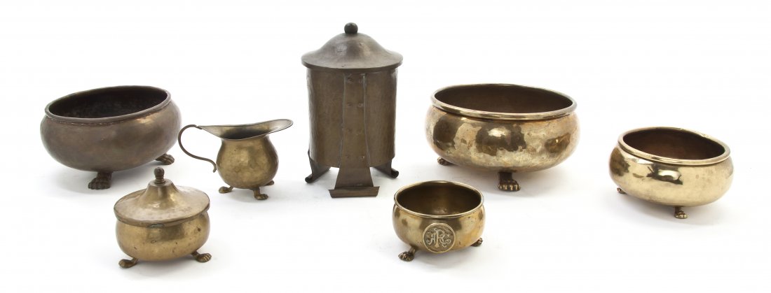 Four Russian Hammered Brass Bowls, Diameter of lar: Four Russian Hammered Brass Bowls, of various sizes, each raised on paw feet, together with an associated creamer and lidded sugar and a Russian Arts and Crafts style humidor with scrolled feet. Diame