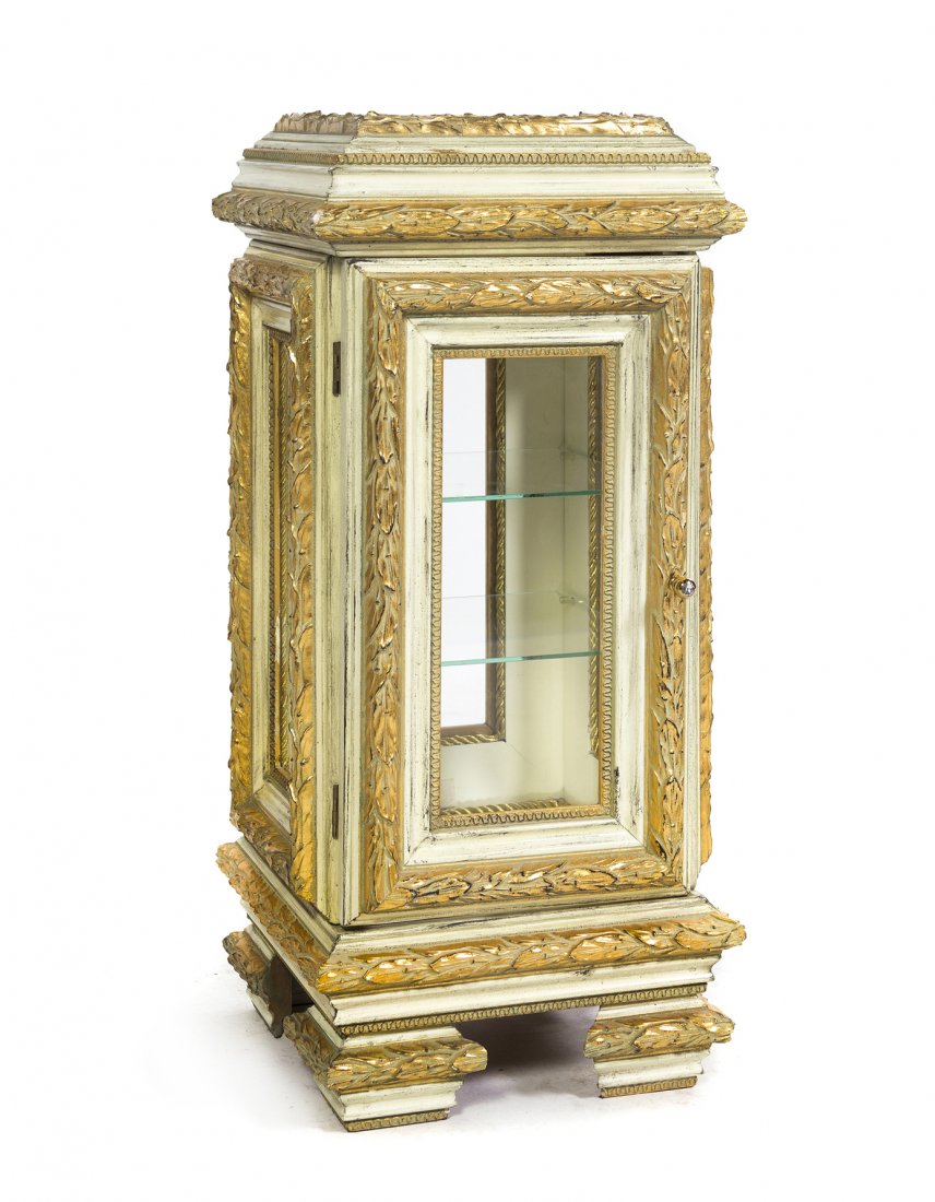 A Painted and Parcel Gilt Table Vitrine, Height 23: A Painted and Parcel Gilt Table Vitrine, with glazed sides and a single glazed door opening to a mirrored interior, the case carved with bands of bellflowers throughout. Height 23 inches.