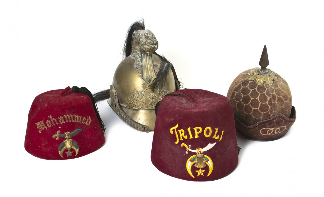 Two Parade Helmets, Height of tallest 9 inches.: Two Parade Helmets, comprising a brass repousse example and a spiked velvet example, together with two fez. Height of tallest 9 inches. Property from the Estate of Mr. Chester E. Zarr, Western Springs