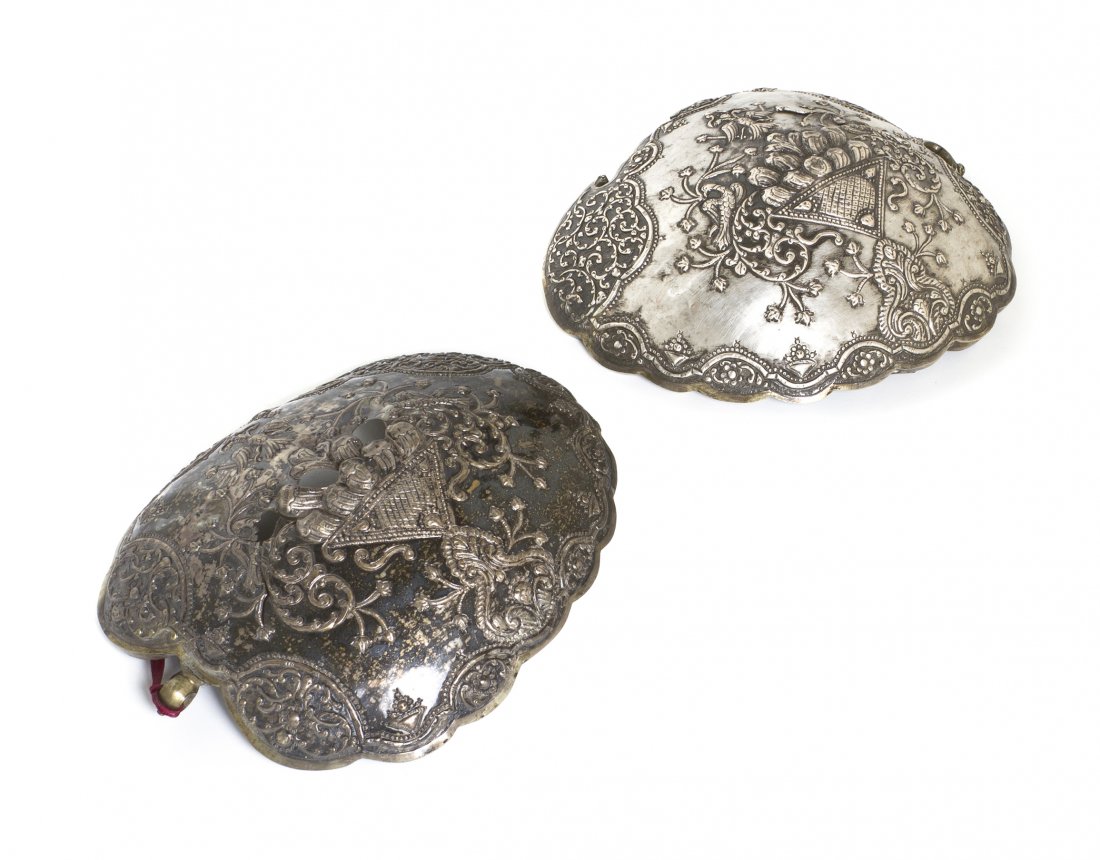 A Pair of Continental Silver Epaulets, Width 8 inc: A Pair of Continental Silver Epaulets, each of typical form with foliate stylized decoration. Width 8 inches. Property from the Estate of Mr. Chester E. Zarr, Western Springs, Illinois