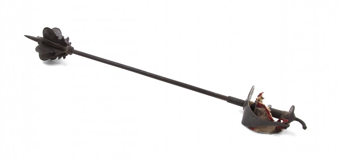 A Continental Steel Mace, Length 32 1/8 inches.: A Continental Steel Mace, 19th century, surmounted with a tapering spike over the eight bladed shaped club, raised on a tubular shaft ending in a basket hilt. Length 32 1/8 inches. Property from the C