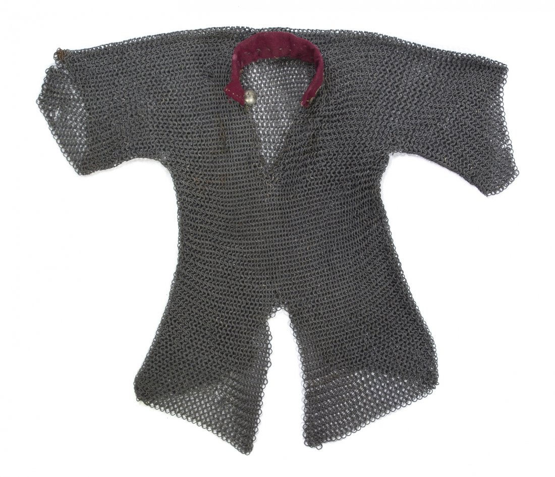 A Chainmail Tunic, likely Persian, Height 29 1/2 x: A Chainmail Tunic, likely Persian, of typical form and construction, with applied felt collar. Height 29 1/2 x width 39 1/4 inches. Property from the Children's Museum of Indianapolis, Indianapolis, I