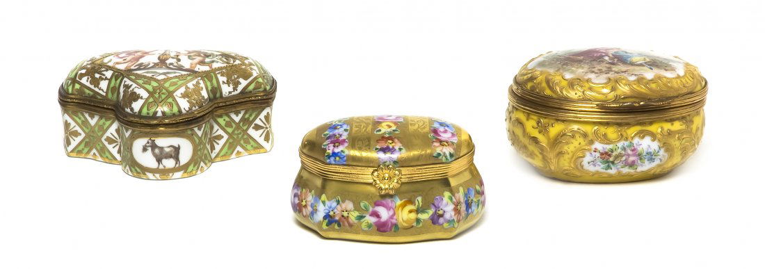 Three Sevres Style Porcelain and Gilt Metal Mounte: Three Sevres Style Porcelain and Gilt Metal Mounted Boxes, one decorated with a courting couple on a yellow ground, one with flowers on a gold ground, and one with putti bearing torches on a white and