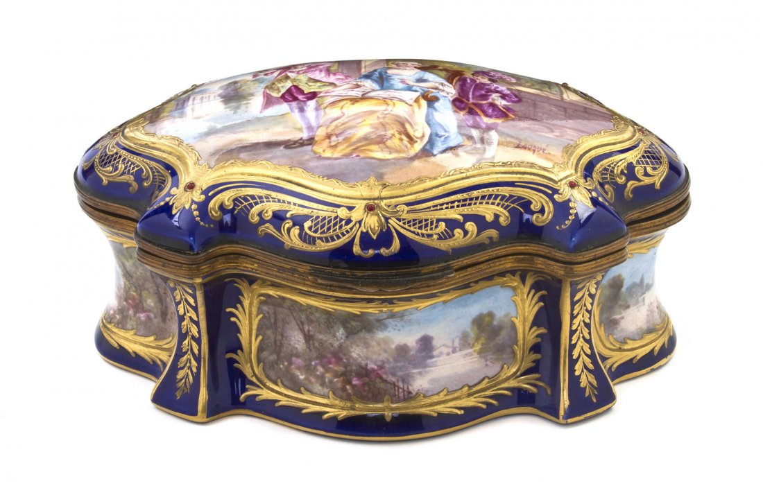 A Sevres Style Porcelain Table Casket, Width 7 inc: A Sevres Style Porcelain Table Casket, late 19th century, of elongated shield form with a cobalt reserve, the lid painted with a gentleman playing the flute, a lady reading sheet music and a boy, sign