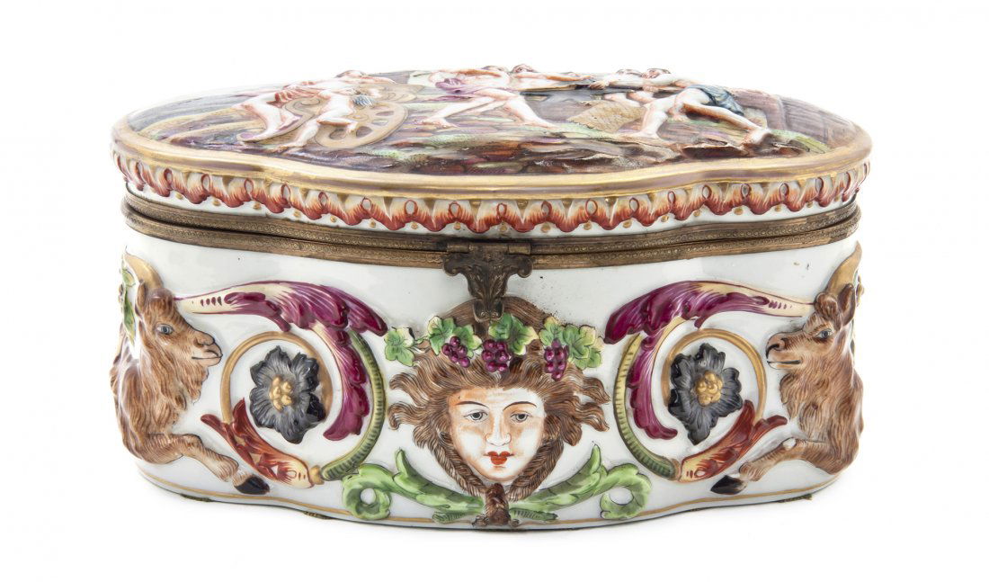 A Capodimonte Porcelain Table Casket, Width 8 3/4: A Capodimonte Porcelain Table Casket, of quatrefoil form, decorated with classical figures in relief. Width 8 3/4 inches. Property from the Ethel Miller Siegel Trust, Bloomfield Hills, Michigan
