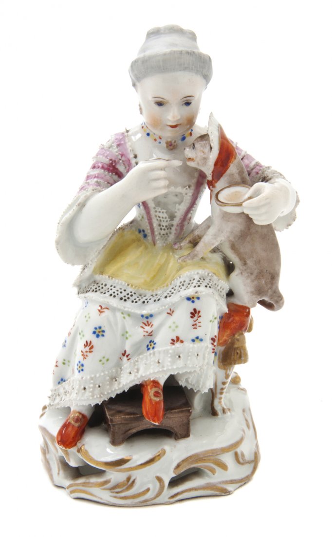 A Royal Vienna Porcelain Figural Group, Height 5 i: A Royal Vienna Porcelain Figural Group, depicting a seated lady feeding her cat, raised on a pierced scrolling gilt decorated base, having impressed shield mark, L:, 845, further painted with crossed