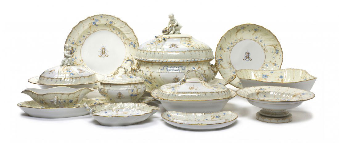 A Berlin (K.P.M.) Porcelain Partial Dinner Service: A Berlin (K.P.M.) Porcelain Partial Dinner Service, comprising two sauce boats with attached underplates, a sauce tureen with an attached underplate, three covered entrees, a leaf form dish, a crescen