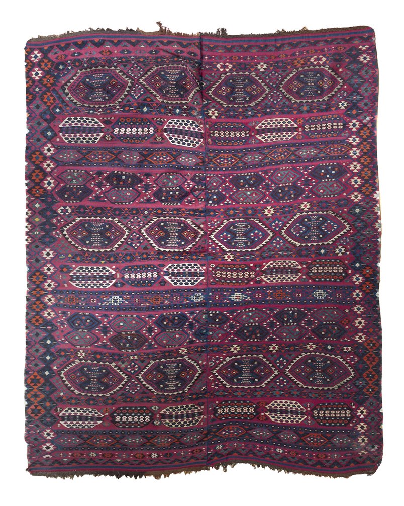 A Persian Wool Rug, 7 feet 4 inches x 5 feet 11 i: A Persian Wool Rug, having repeating geometric decoration on a red reserve within multiple borders. 7 feet 4 inches x 5 feet 11 inches. Property from the Collection of Mr. and Mrs. Greg Friedman, Chic