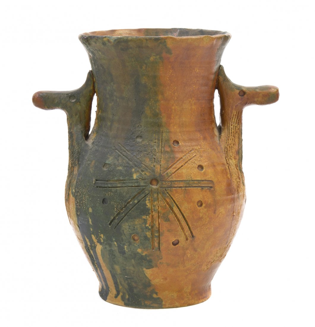 An Italian Pottery Vase, Raymor, Height 10 1/4 in: An Italian Pottery Vase, Raymor, of handled baluster form, the handles of stylized animal form, the body having incised geometric decoration, executed in a blue and green glaze. Height 10 1/4 inches.