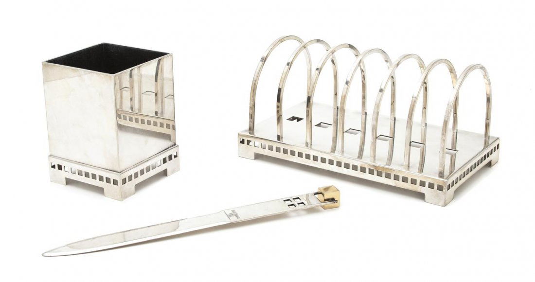 An Italian Silverplate Desk Set, Richard Meier fo: An Italian Silverplate Desk Set, Richard Meier for Swid Powell, each item having geometric cut-out design, comprising a letter rack, a letter opener and a pencil cup, each stamped Swid Powell/Made in
